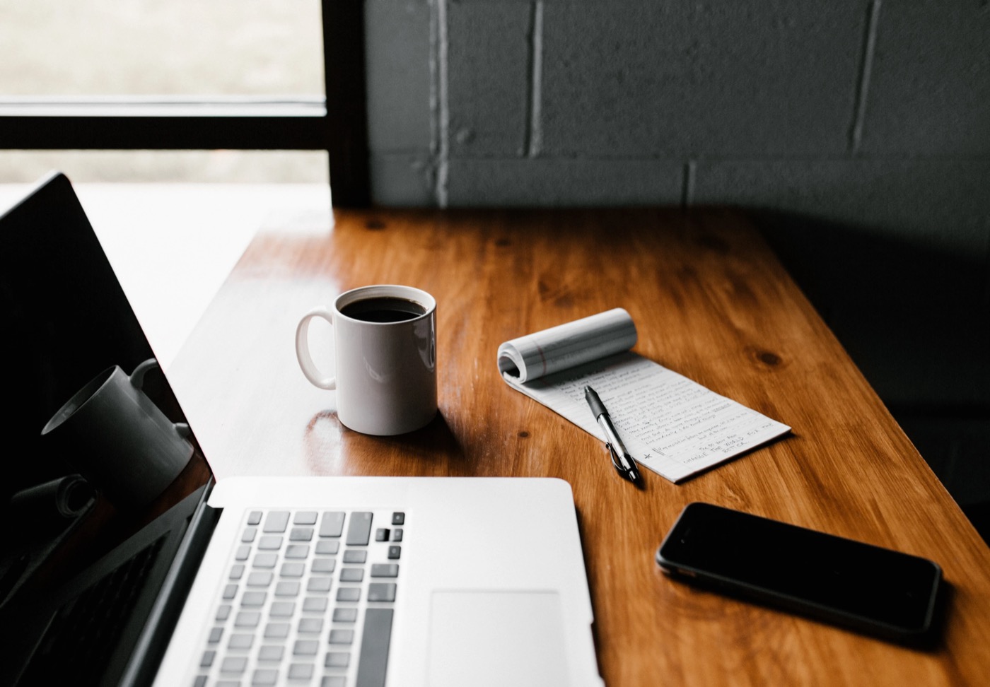 Laptop and coffee on a desk